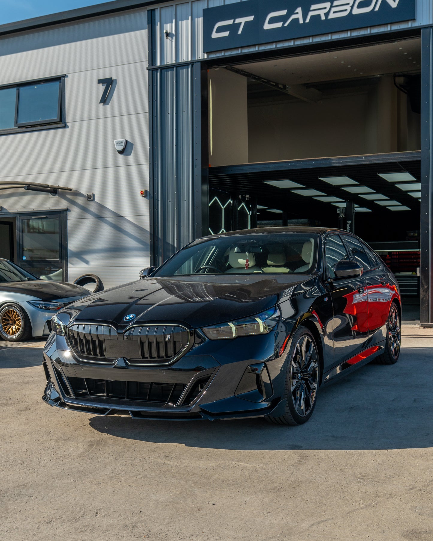 BMW 5 SERIES G60 & i5 2023+ GLOSS BLACK SPLITTER-Splitter-BLAK BY CT-CT Carbon - High-quality carbon fiber and gloss black aerodynamic parts for premium sports and luxury vehicles.