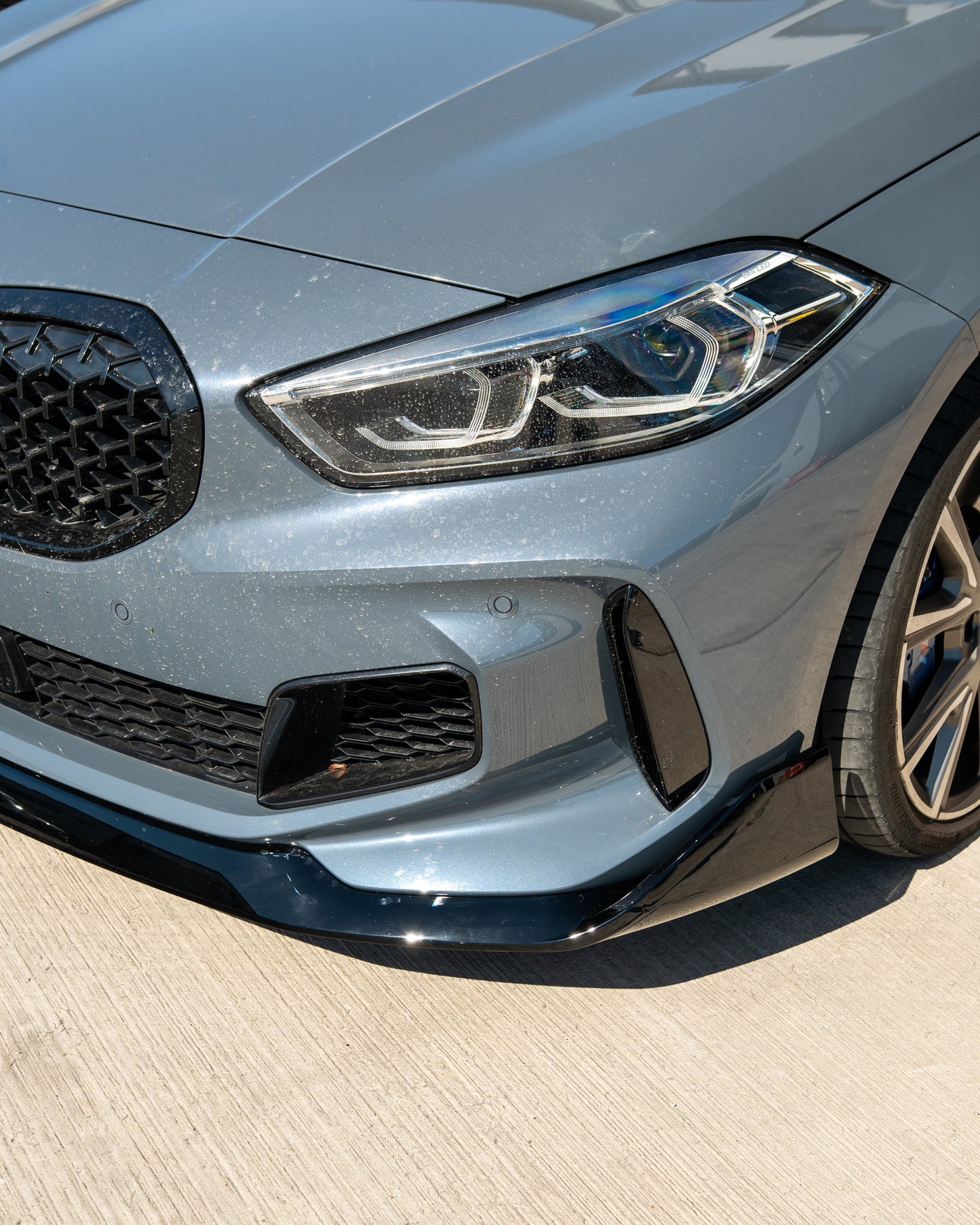 BMW F40 1 SERIES GLOSS BLACK SPLITTER - MP STYLE-Splitter-BLAK BY CT-CT Carbon - High-quality carbon fiber and gloss black aerodynamic parts for premium sports and luxury vehicles.