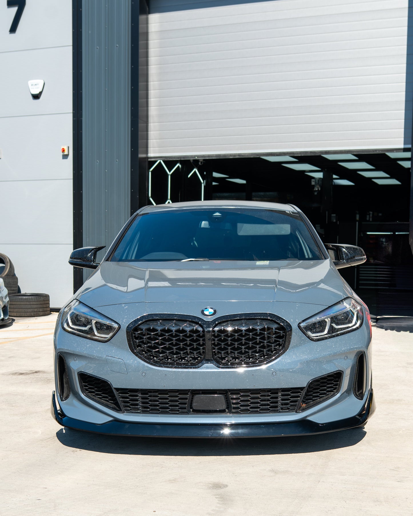 BMW F40 1 SERIES GLOSS BLACK SPLITTER - MP STYLE-Splitter-BLAK BY CT-CT Carbon - High-quality carbon fiber and gloss black aerodynamic parts for premium sports and luxury vehicles.