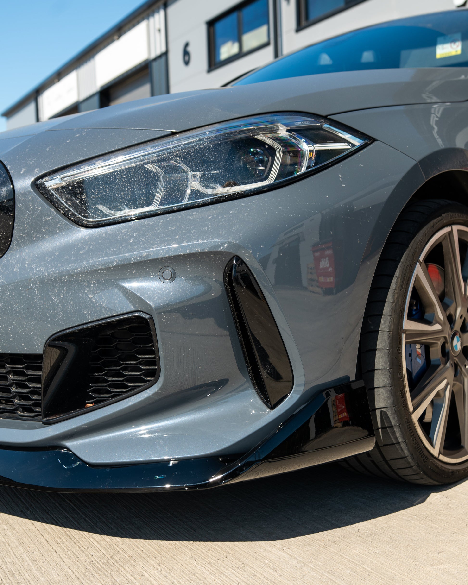 BMW F40 1 SERIES GLOSS BLACK SPLITTER - MP STYLE-Splitter-BLAK BY CT-CT Carbon - High-quality carbon fiber and gloss black aerodynamic parts for premium sports and luxury vehicles.