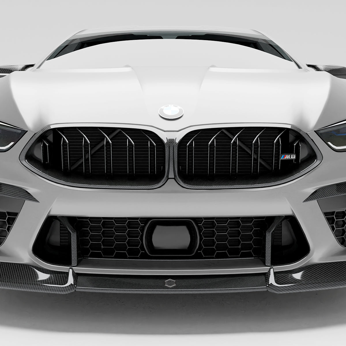 BMW M8 F92  with a carbon fiber griile close-up  on a white background