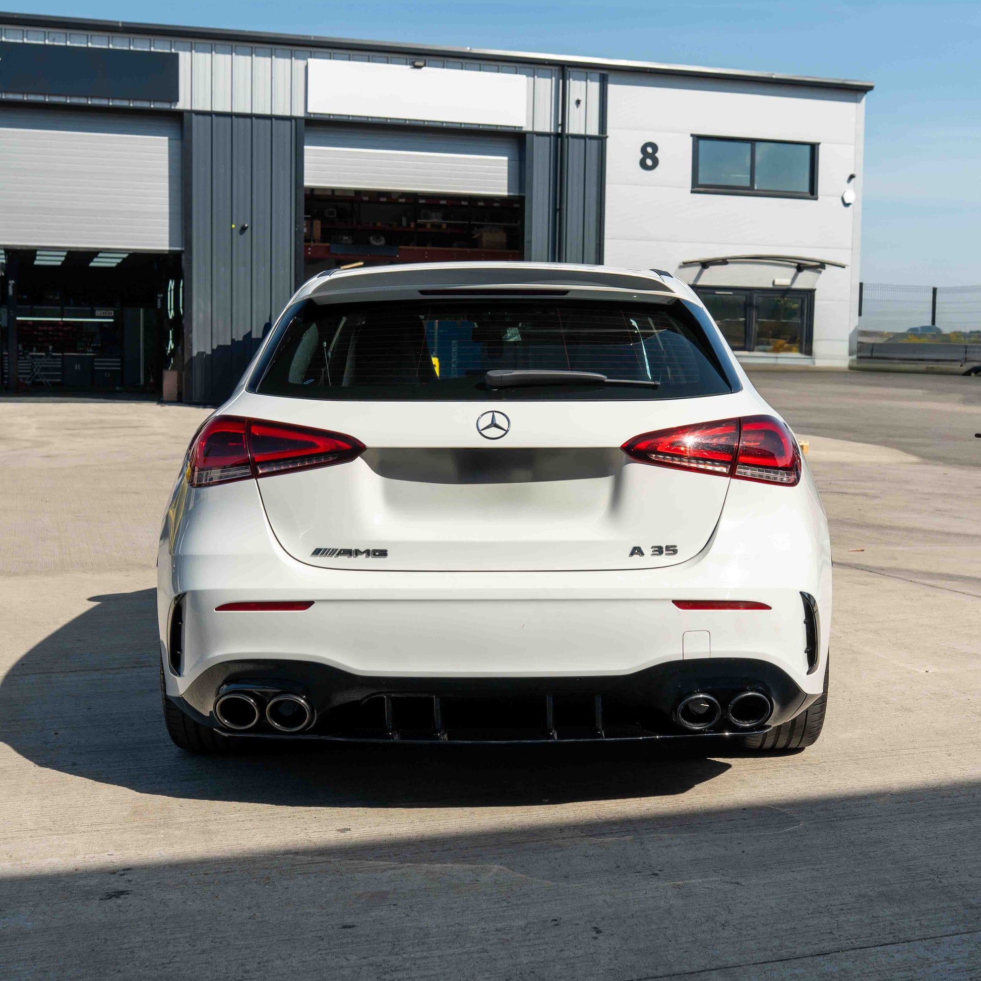 MERCEDES A-CLASS W177 2018-CURRENT GLOSS BLACK QUAD TIP DIFFUSER-Diffuser-BLAK BY CT-CT Carbon - High-quality carbon fiber and gloss black aerodynamic parts for premium sports and luxury vehicles.