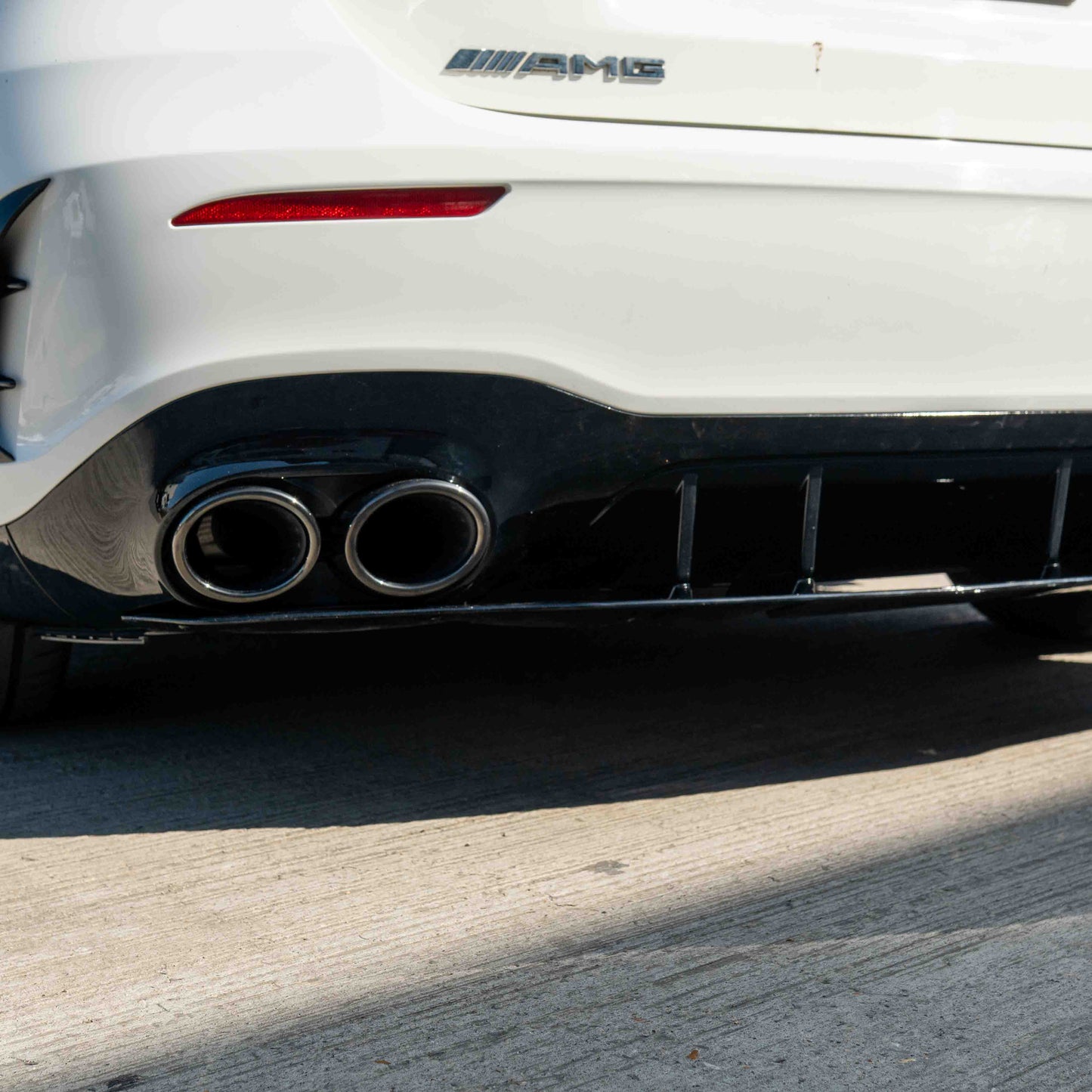 MERCEDES A-CLASS W177 2018-CURRENT GLOSS BLACK QUAD TIP DIFFUSER-Diffuser-BLAK BY CT-CT Carbon - High-quality carbon fiber and gloss black aerodynamic parts for premium sports and luxury vehicles.