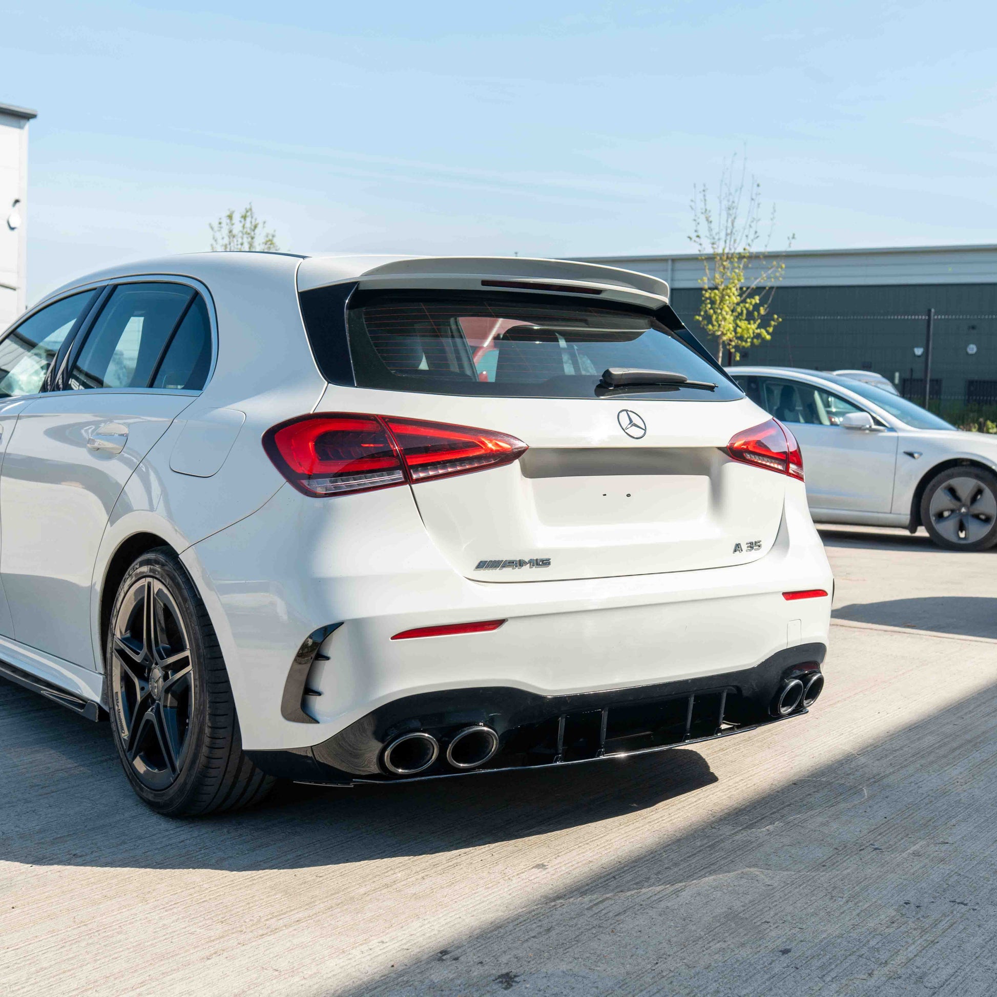 MERCEDES A-CLASS W177 2018-CURRENT GLOSS BLACK QUAD TIP DIFFUSER-Diffuser-BLAK BY CT-CT Carbon - High-quality carbon fiber and gloss black aerodynamic parts for premium sports and luxury vehicles.
