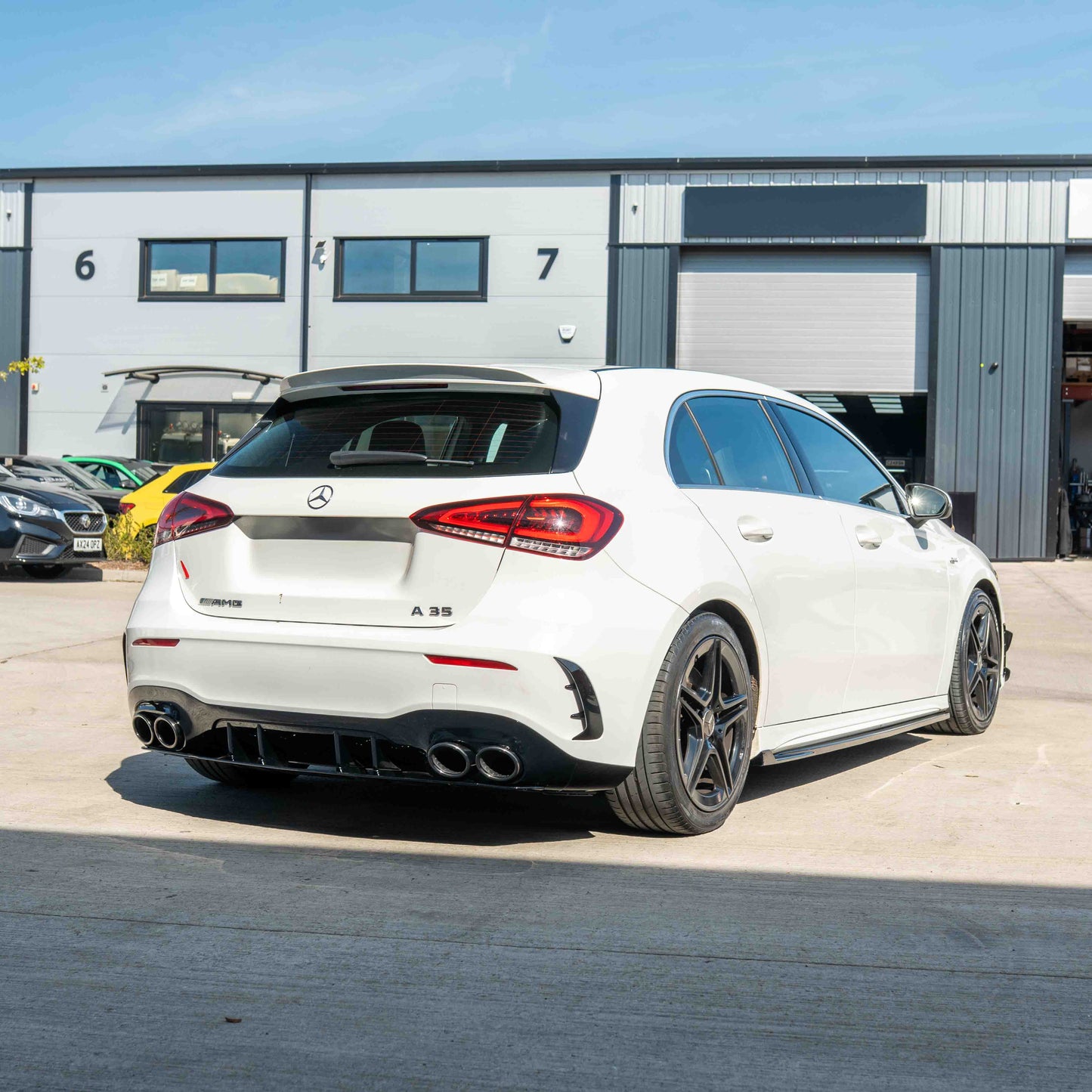 MERCEDES A-CLASS W177 2018-CURRENT GLOSS BLACK QUAD TIP DIFFUSER-Diffuser-BLAK BY CT-CT Carbon - High-quality carbon fiber and gloss black aerodynamic parts for premium sports and luxury vehicles.